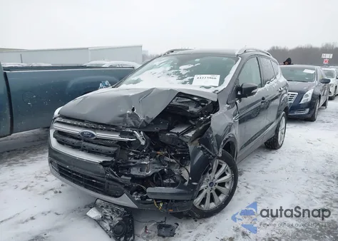 2017 Ford Escape Titanium z USA, uszkodzony, nr VIN 1FMCU9J99HUE89713